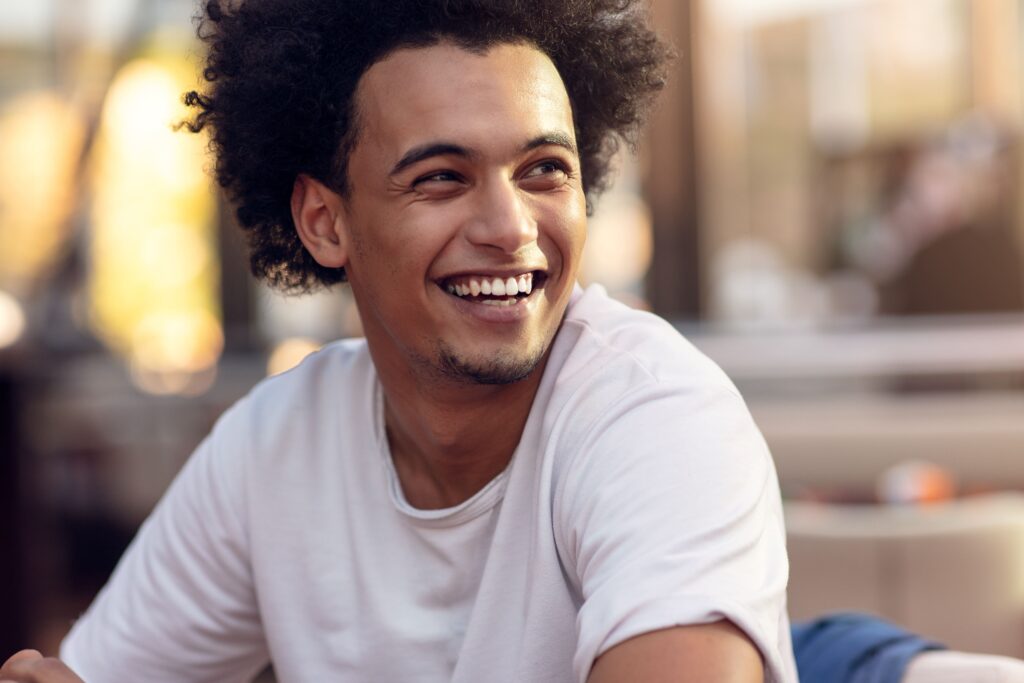 Man Smiling and Looking to the side